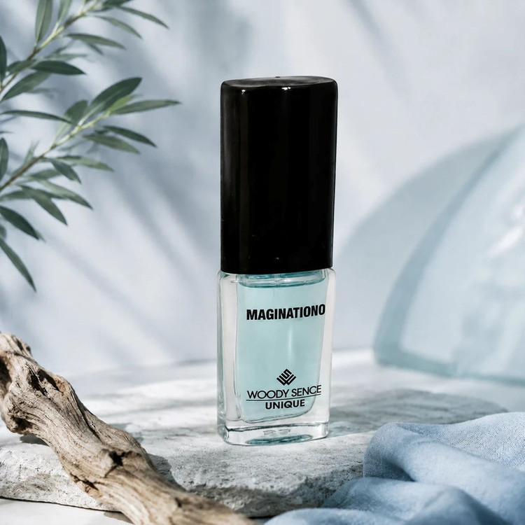 عطر جیبی مردانه وودی سنس مدل Maginationo با رایحه شیرین و چوبی حجم 15 میلیلیتر