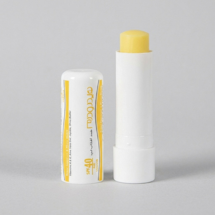 بالم لب هیدرودرم مدل SPF40 مرطوبکننده و ضدآفتاب با عصاره آلوئهورا و شیباتر، مقاوم در برابر آب و تعریق، مناسب پوست خشک، جامد ماتیکی، وزن 4.5 گرم